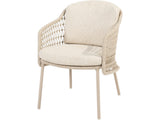 Puccini tuinstoel van 4 Seasons Outdoor schuin van voren, met licht open vlechtwerk en beige kussens.